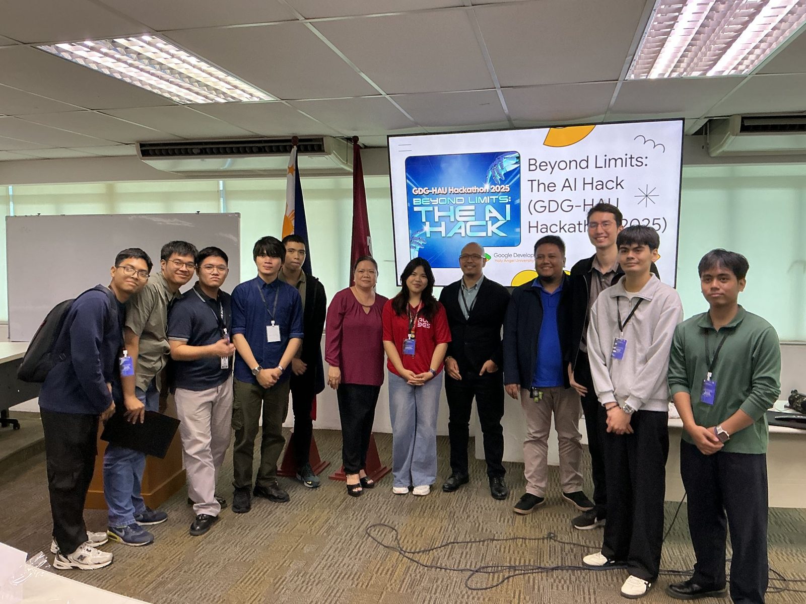 Organizers, judges and teams lined up in front of the Beyond Limits: The AI Hack title slide after the demos