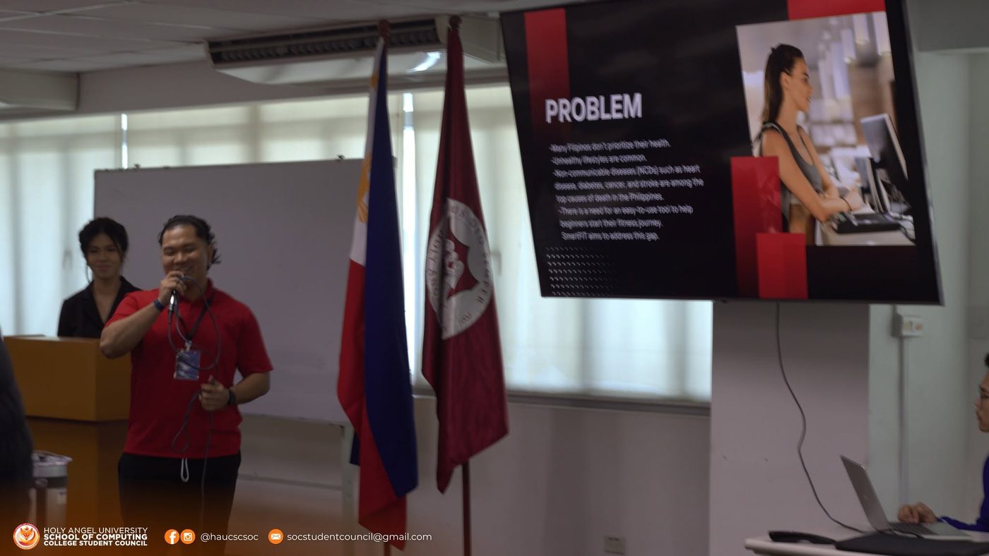 A team presenting SmartFIT, the problem slide listing the non-communicable diseases that kill the most Filipinos