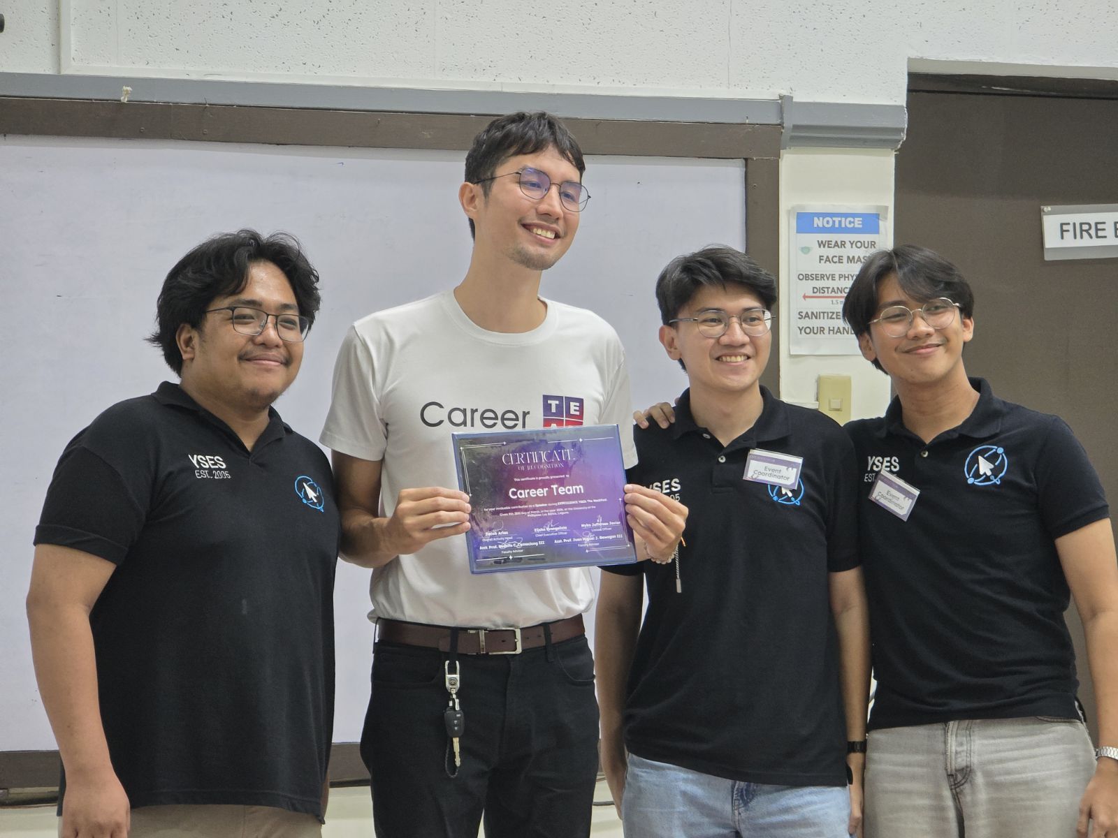 Three YSES officers handing me the sponsor certificate of recognition for Career Team